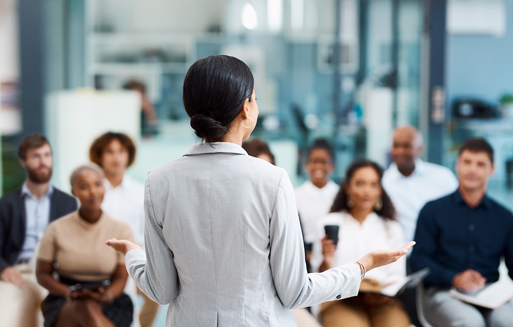 A woman leads a custom leadership development program